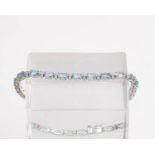 Armband, 18kt Weißgold, Brillanten zus. ca. 0.45 ct., etwa w/si, 27 Topase zus. ca. 5.70 ct., ca. 9