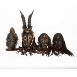 Konvolut 4 Tanzmasken, Dan, Liberia, Baule, Elfenbeinküste, Afrika, Holz, mit meist dunkler Patina,