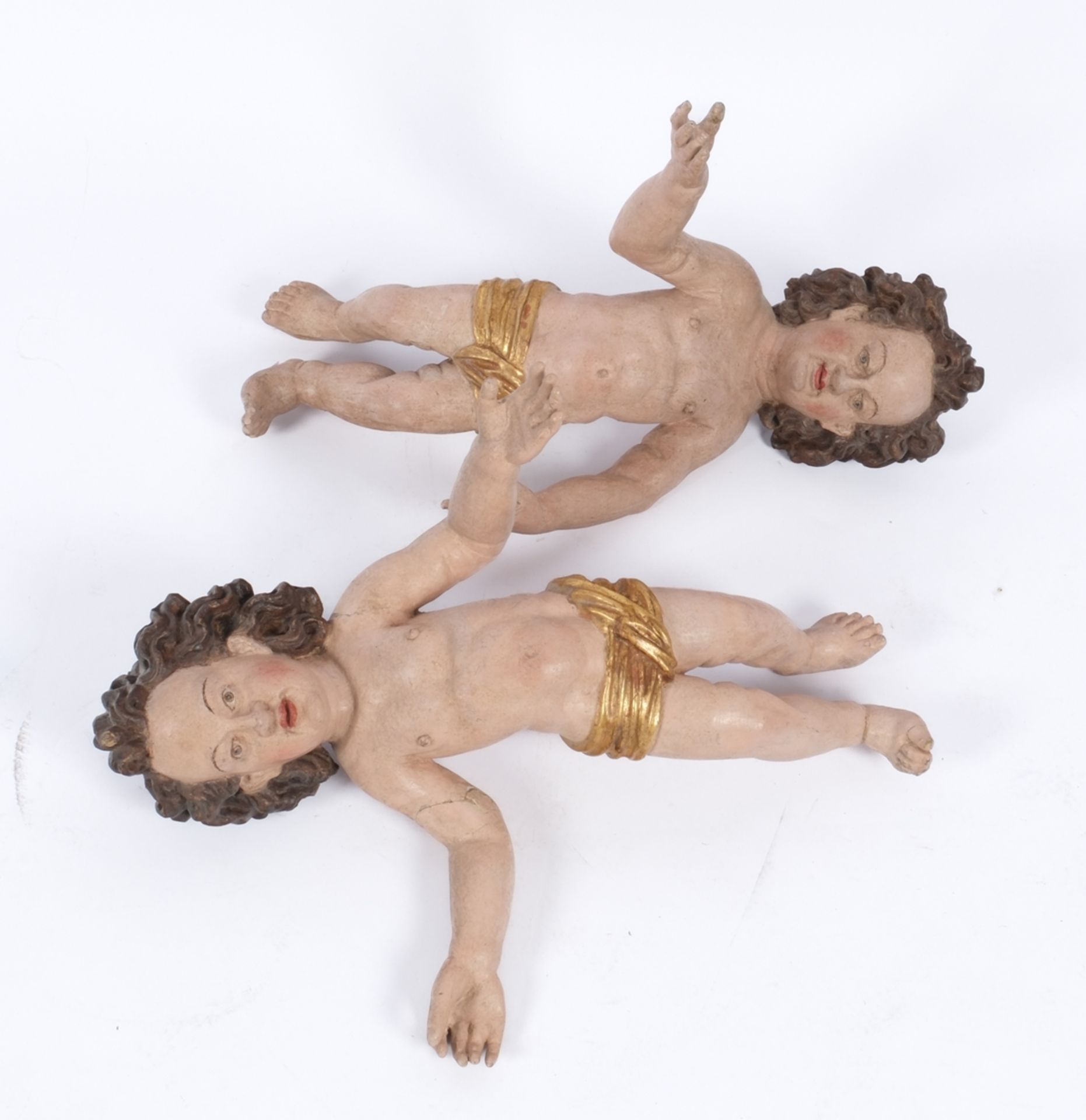 "Paar Putten", süddeutsch um 1700, Holz, farbig gefasst, 43 cm hoch, diverse Risse und fehlende Flü