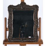 Barockspiegel, 18. oder 19. Jh., Nussbaum reich geschnitzt, Glas wohl ergänzt, 60 x 45 cm
