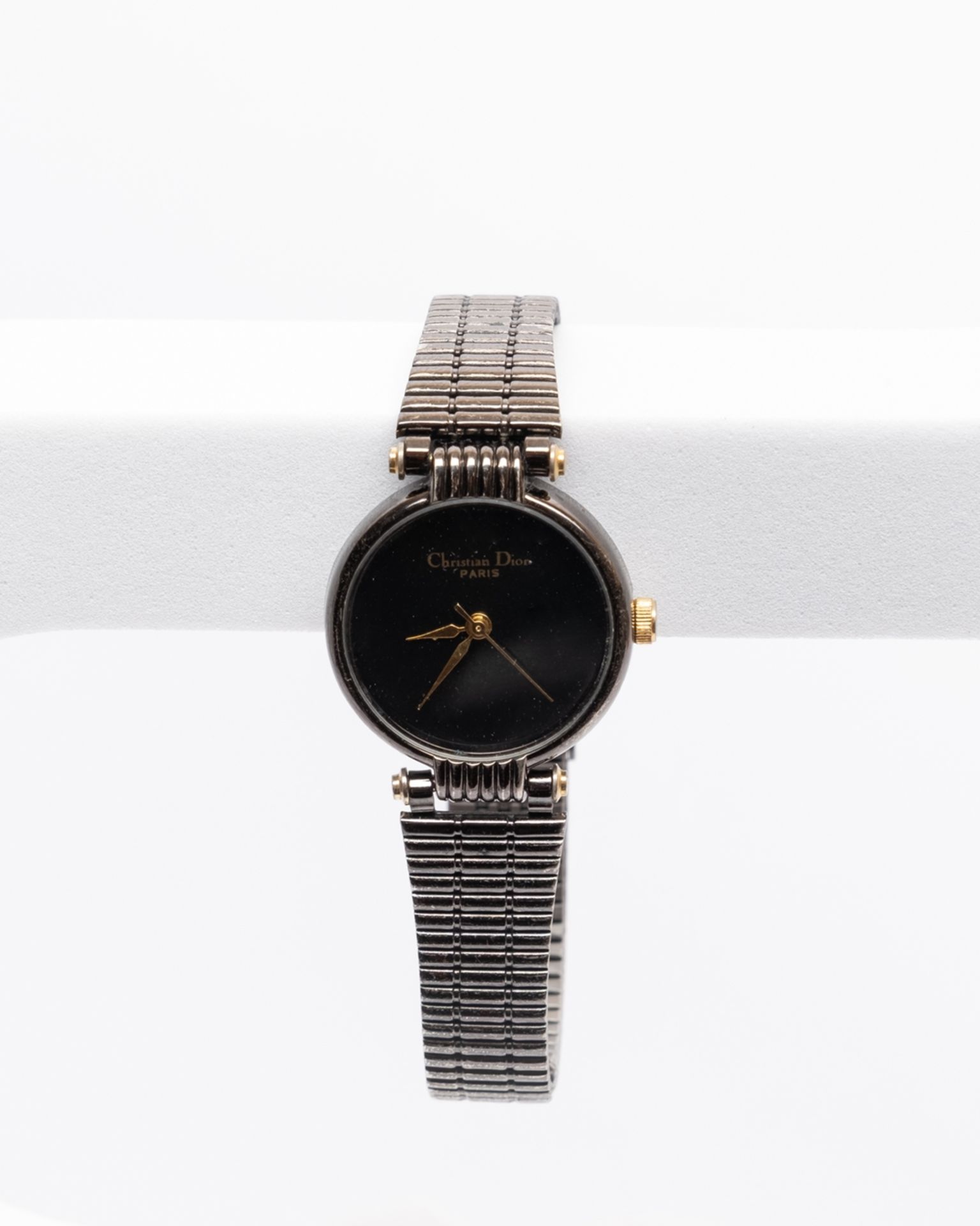 Christian Dior, um 1990, Damenarmbanduhr, brüniertes Gehäuse in Stahl mit goldfarbener Krone, schwa