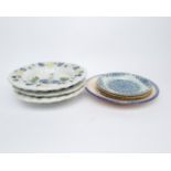 Konvolut 3 Teller und 4 Platten, Fayence, diverse Motive und Dekore, ø ca. 23-32 cm, Randabplatzung