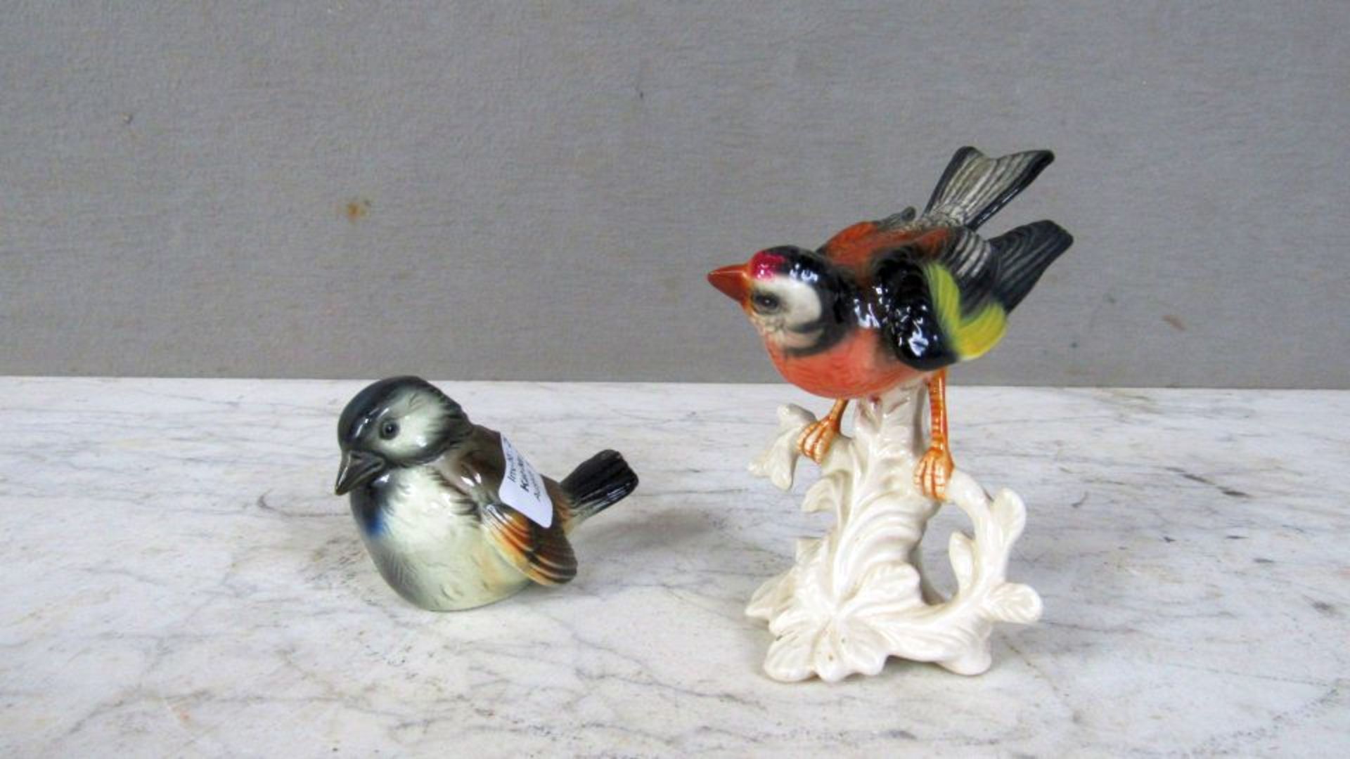 Zwei Figuren Vögel