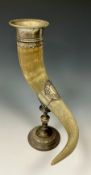 A German WMF drinking horn and stand, the bovine horn vessel with silver plated stand and mounts,