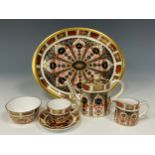 A Royal Crown Derby 1128 Old Imari miniature cabaret set comprised of a tea pot, sugar bowl, milk