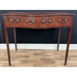 A George lll mahogany serpentine side table, slightly oversailing top above four working drawers