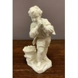 An 18th century Sevres biscuit figure of a boy with a basket of flowers by his feet, 19cm high.
