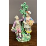 An 18th century Derby group of Autumn and Summer, the gentleman holding the grapes, the other