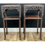 A pair of Chinese hardwood side tables, the rectangular top inset with variegated pinky red marble