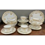 A Royal Crown Derby 8438 pattern tea set for six, decorated with gilt swags and scrolling borders,
