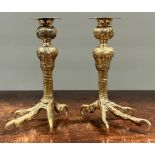 A pair of 19th century gilt brass candlesticks, cast in the Renaissance manner as birds feet, 19.5cm