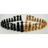 A late 19th century Calvert pattern boxwood and ebony chess set, turned and carved detailing, the