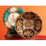 A Meissen porcelain fruit bowl, relief moulded with gilt floral sprays, cobalt panelled ground,