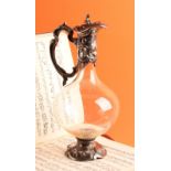 An Art Nouveau design claret jug, in the manner of WMF, hinged cover, scroll base, 32cm high