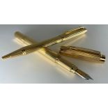 A Waterman solid 18ct gold 'Ideal' fountain pen and 18ct gold ballpoint pen set, the two tone
