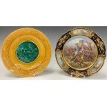 A French porcelain shaped circular cabinet plate, in the manner of Sevres, decorated in polychrome