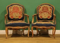A pair of Louis XV Revival beech armchairs, each with stuffed-over upholstery, cabriole legs, 93cm