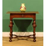 An 18th century oak side table, oversailing rectangular top above a long frieze drawer, turned