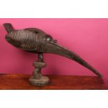Tribal - a Baga A-Tshol shrine carving, of zoomorphic form, carved as a stylized bird with elongated