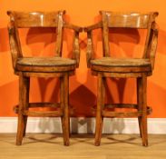A pair of contemporary fruitwood swivel bar stools, possibly Guy Chaddock & Co, 96cm high, 56cm
