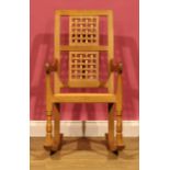 Robert Thompson, Mouseman of Kilburn - an oak rocking chair, carved mouse signature, 95.5cm high,