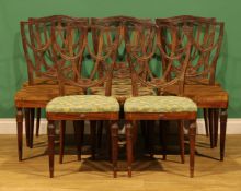 A set of eight Sheraton Revival rosewood dining chairs, each shield-shaped back carved with bell