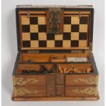 A 19th century brass mounted walnut rectangular games compendium, in the Aesthetic Movement taste,