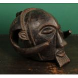 Tribal Art - a Luba helmet mask, carved angular nose, slit elliptical eyes, his chin with a