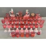 Glassware - a Victorian cranberry glass decanter, 25cm high; another, 22cm high; cranberry glass