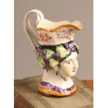 A 19th century Staffordshire creamware commemorative mask jug, modelled with a portrait of