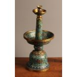 An 18th century Chinese cloisonne candlestick, circular drip pan centred by tapered cylindrical