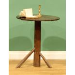 An 18th century provincial oak tripod table, round oversailing top supported by an octagonal column,