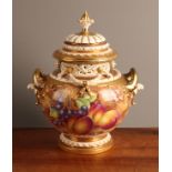 A Royal Worcester ovoid two-handled pot pourri vase and cover, painted by Freeman, signed,