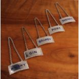 A set of five Elizabeth II silver and enamel decanter labels, gin, whisky, sherry, brandy and