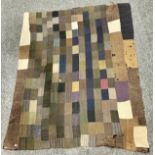 An unusual Welsh patchwork or suiting quilt, constructed with gentlemen’s cotton and tweed suit