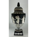 A Wedgwood 'Dancing Hours' jasperware pedestal urn and cover, the upper section decorated with a