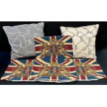A set of six tapestry woven cushion covers decorated with the Royal Coat of Arms crest against Union