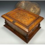 A 19th century German walnut Symphonion music box, the lid with pressed embossed decorated panel,