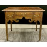 A George ll oak lowboy, moulded top over three drawers each fitted with brass swan-neck handles,