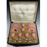 A cased set of six Royal Worcester coffee cans and saucers, in a light pink colour with intricate