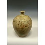 A Studio pottery vase, in the manner of Bernard Leach, of classic globular ovoid form, tapering to a