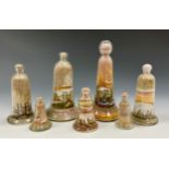 A group of seven Isle of Wight Curiosities, arranged with sands from the coloured cliffs of Alum