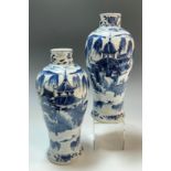 A Pair of Chinese Qing period blue and white Meiping form vases, each painted in under-glaze blue