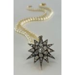 A 19th century diamond star pendant the triple layered twelve pointed star set with thirty three old