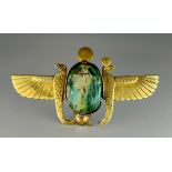 A Egyptian winged scarab brooch, carved central scarab within unmarked yellow metal mount, testing