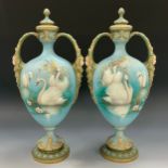 A pair of late Victorian Royal Worcester porcelain twin handled vases and covers, painted by C H C