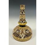 A Zsolnay Pecs reticulated bottle vase, glazed in tones of yellow and blue, picked out in gilt, 18cm