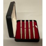 A set of four silver and enamel bridge pencils, decorated in red and black with the four playing