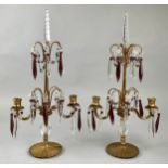 A pair of 19th century gilt bronze and amethyst and clear glass two-light table lustre candelabra,
