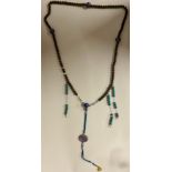 A Chinese Mandarin court necklace (chao zhu), formed of carved nut and cloisonne enamelled silver